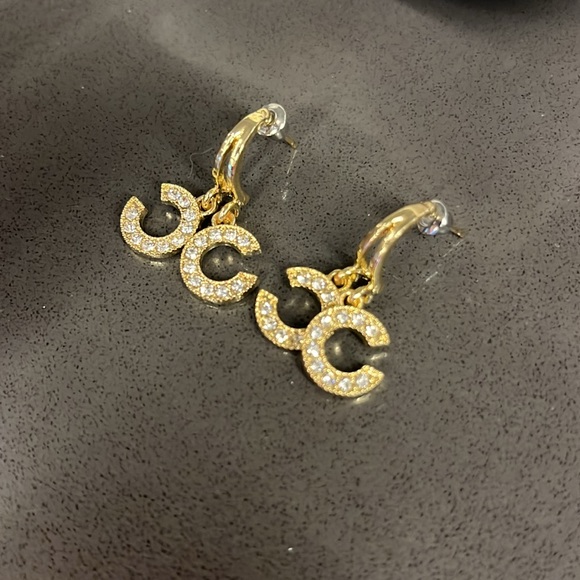 Gold tone “c” style dangly huggie earring. - Picture 3 of 3